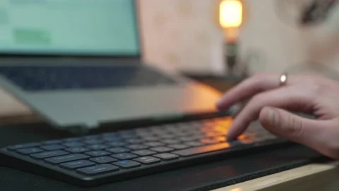 Typing on keyboard, laptop with wireless bluetooth keyboard and mouse Stock Footage 232612941