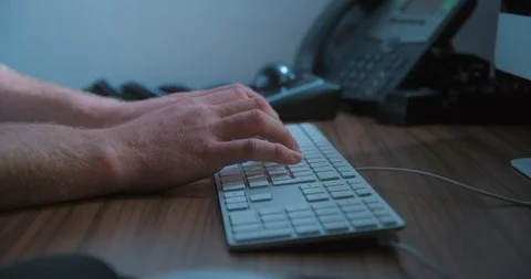 Typing keyboard man remote working, close-up slow motion, studio shot in 4K Stock Footage 126368974