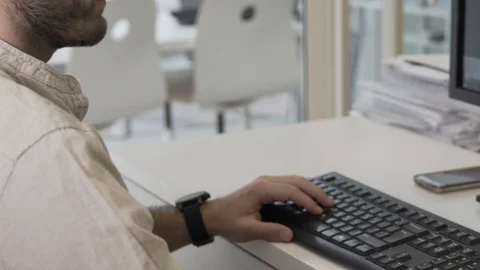 Typing on a keyboard. Man using mouse and typing on computer keyboard. Video stock 99992633