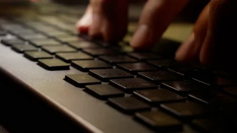 Typing on keyboard at night, close-up of man hands Stock Footage 194284678