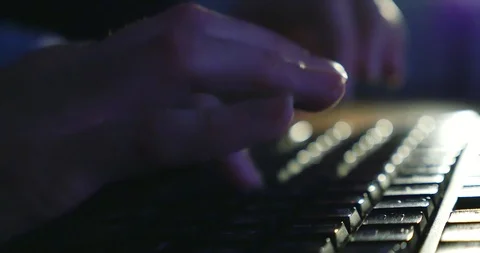 Typing on keyboard at night. Dark background lighting. Close-up Stock Footage 98708230