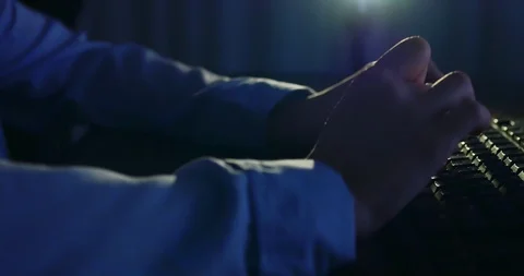 Typing on keyboard at night. Dark background lighting. Close-up Stock Footage 98736783