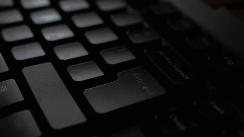 Typing on keyboard, press Enter. Hands print on the keyboard in dark office. Stock Footage 106993832