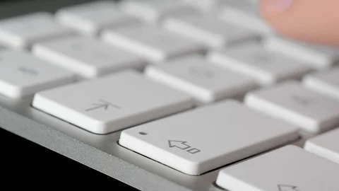 Typing on keyboard, pressing the Shift and Caps Lock buttons. Close-up Stock Footage 125406554