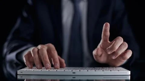 Typing on the keyboard thumbs up close up Stock Photos