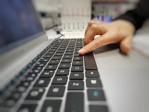 Typing on the keyboard. Using the keyboard. The hand on the keyboard. Stock Photos