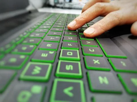 Typing on the keyboard. Using the keyboard. The hand on the keyboard. Stock Photos