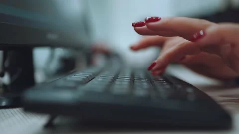 Typing on the keyboard, women's hands with red manicure typing on the keyboard Stock Footage 219513492