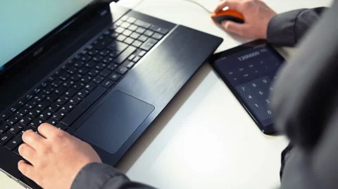 Typing on Laptop and Calculating Stock-Footage 49285977