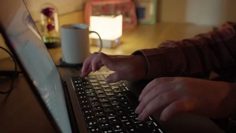 Typing on Laptop and Drinking Coffee at Warm Home Workspace Stock Footage 344947532