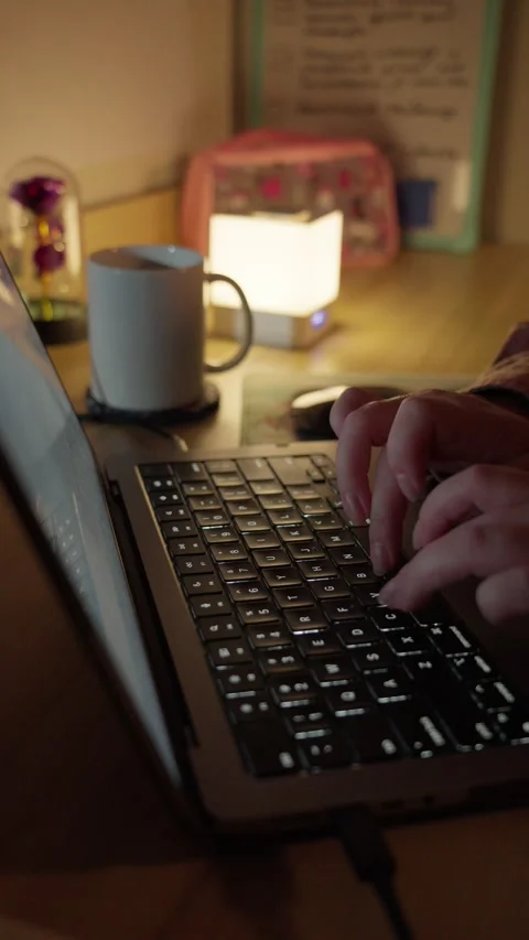 Typing on Laptop and Drinking Coffee at Warm Home Workspace Vídeos de archivo 344950395