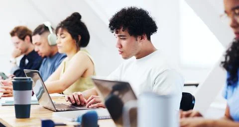 Typing, laptop and man in class for learning, thesis review or student with.. Stock Photos