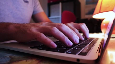 Typing On Laptop With Blue Light Reflecting On Hands Stock Footage 248782686