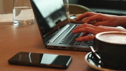 Typing on a laptop in a cafe Stock Footage 171621126
