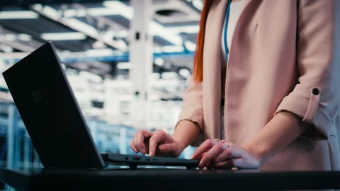 Typing, laptop close up and engineer in server farm Stock Footage 330088659