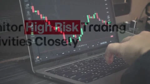 Typing on Laptop With Falling Stock Chart and Risk Text Stock Footage 337732775