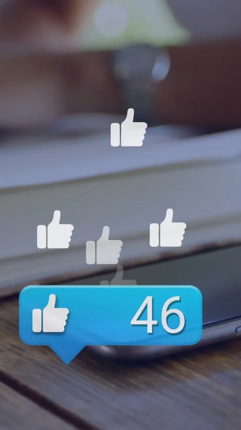 Typing on laptop with floating thumbs-up animation in school environment Stock Footage 344403953