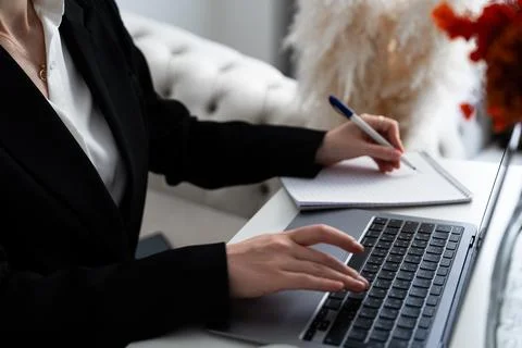 Typing on laptop, focused hands and keyboard close-up Stock-Fotos