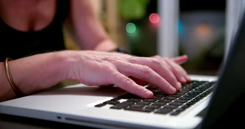 Typing on a laptop: 動画素材 346649533