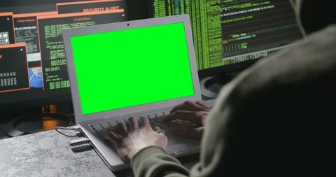 Typing on a laptop with green screen 動画素材 104607158