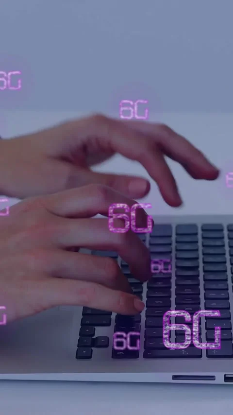 Typing on laptop, hands displaying 6G technology animation in school setting Stock Footage 344370395