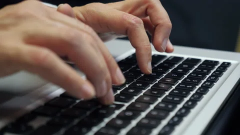 Typing on a laptop Keyboard close up Stock Footage 154339802
