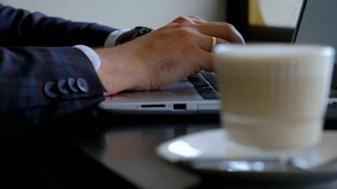 Typing on a laptop keyboard in close-up. Hands typing on computer keys Stock Footage 142350429