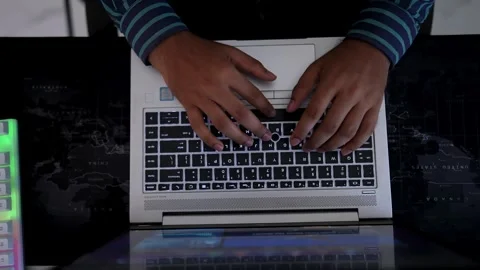 Typing on Laptop Keyboard in Dim Lighting, Person typing on a laptop keyboa.. Stock Footage 317737363