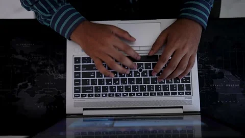 Typing on Laptop Keyboard in Dim Lighting, Person typing on a laptop keyboa.. Stock Footage 317737368