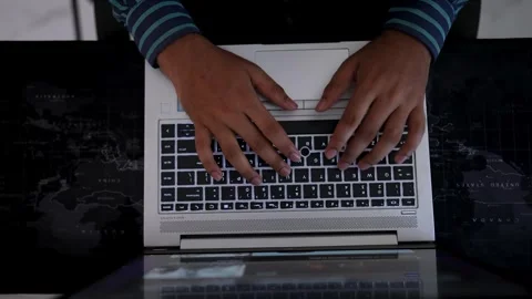 Typing on Laptop Keyboard in Dim Lighting, Person typing on a laptop keyboa.. Stock Footage 317737373