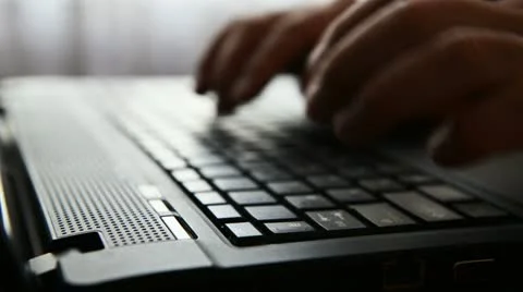Typing on a laptop keyboard Stock Footage