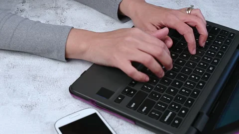 Typing on laptop keyboard Stock Footage 168105367
