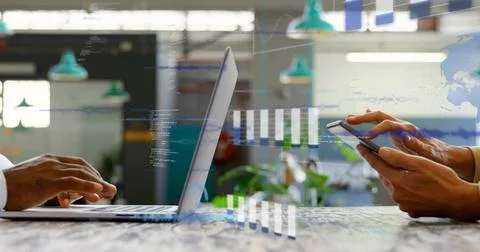 Typing on laptop left blazer cuff right long-sleeve tapping phone at coworking Stock Photos