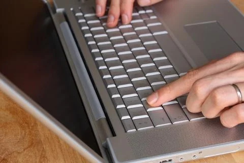 Typing on a laptop Stock Photos