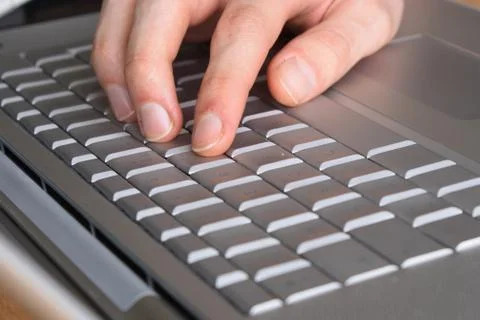 Typing on a laptop Stock Photos