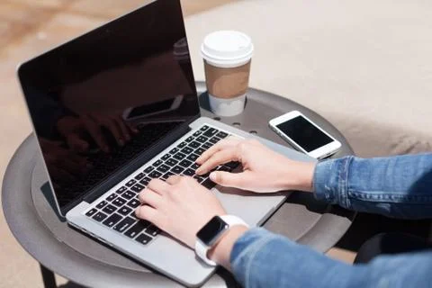 Typing on a laptop Stock Photos