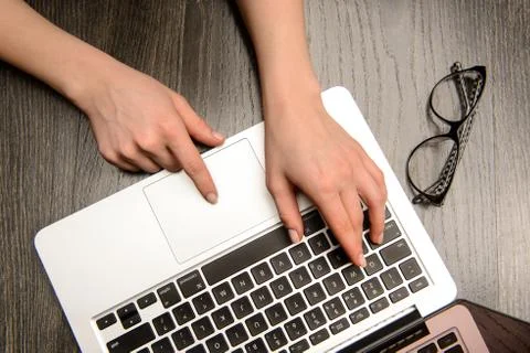Typing on a laptop Stock Photos