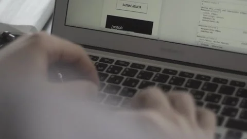 Typing on a laptop. They work in the office. Work in the office. Stock Footage 130225415