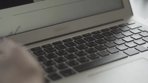 Typing on a laptop. They work in the office. Work in the office. Stock Footage 130225442