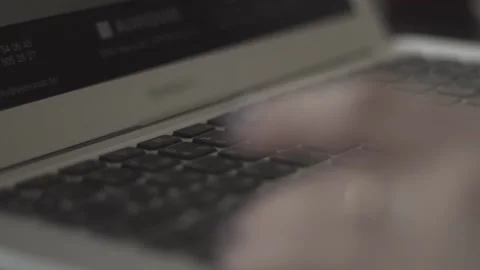 Typing on a laptop. They work in the office. Work in the office. Stock Footage 130225476