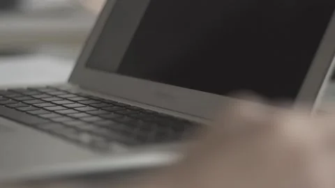 Typing on a laptop. They work in the office. Work in the office. Stock Footage 130225728