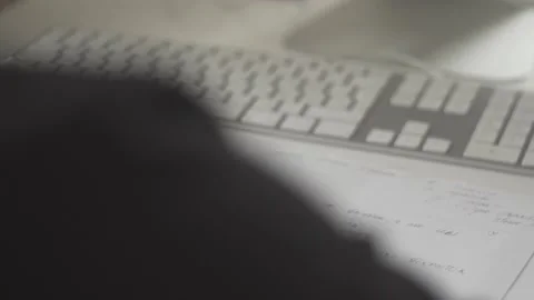 Typing on a laptop. They work in the office. Work in the office. Stock Footage 130225899
