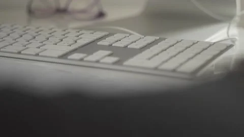 Typing on a laptop. They work in the office. Work in the office. Stock Footage 130225929
