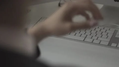 Typing on a laptop. They work in the office. Work in the office. Stock Footage 130227260