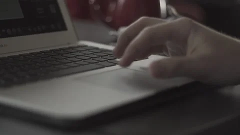 Typing on a laptop. They work in the office. Work in the office. Stock Footage 130227418