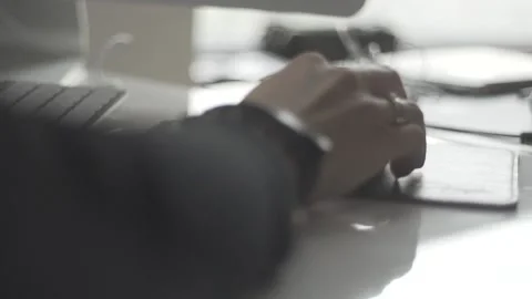 Typing on a laptop. They work in the office. Work in the office. Stock Footage 130227472