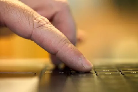 Typing on a laptop at work Stockfoto's