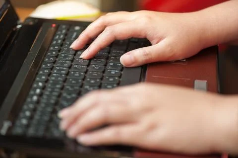 Typing on latop keyboard Stock Photos
