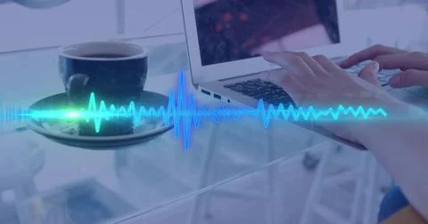 Typing light-sleeved hands using laptop on glass table, coffee cup reflected and Stock Photos