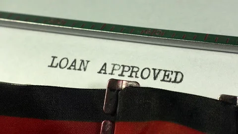 Typing Loan Approved on a manual typewriter. Credit. Stock Footage 238002614